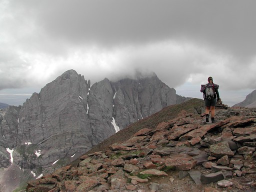 Suzy heading back down from the summit of Humbolt Peak with the Crestones lurking in the background