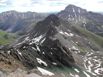 Looking down Wetterhorn’s 4th class east ridge toward Matterhorn Peak, with Uncompahgre Peak in the background