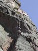 Jay Woods of Denver leading through the 2nd pitch roof crux on Anthill Direct, Red Garden Wall, Eldorado Canyon