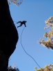 Silhouette shot of Josh with a leaping Rap Jump over an overhang