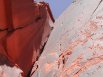 Looking roughly straight up, while belaying, at John halfway up Meat Hooks, Original Meat Wall