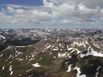 Beautiful endless view of the mountains from Wetterhorn Peak, with scattered snow patterns everywhere
