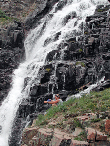 Cooling off at a waterfall after our ascent of Mount Sneffels