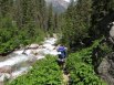 Suzy Hiking back down along the beautiful Needleton Creek from Chicago Basin toward Needleton Trailhead, San Juan Mountains, Colorado