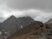 Suzy heading back down from the summit of Humbolt Peak with the Crestones lurking in the background