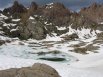 Looking west down at Twin Lakes, still mostly iced up on July 4th, while descending from Mt Windom, San Juan Mountains, Colorado