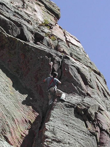 Jay Woods of Denver leading through the 2nd pitch roof crux on Anthill Direct, Red Garden Wall, Eldorado Canyon, Boulder, Colorado