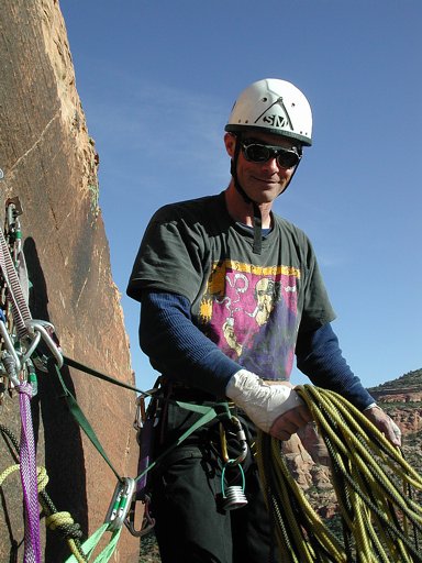 Ben ready to throw the rope, starting the rappel down Otto's Route, Monument Rock, Colorado National Monument