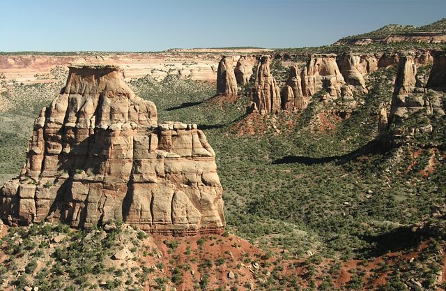 Independence Monument, taken from the Canyon Rim Trail, also shows Grand View Spire, Kissing Couple and Dirty Old Man Tower, and Rainbow Tower in the background