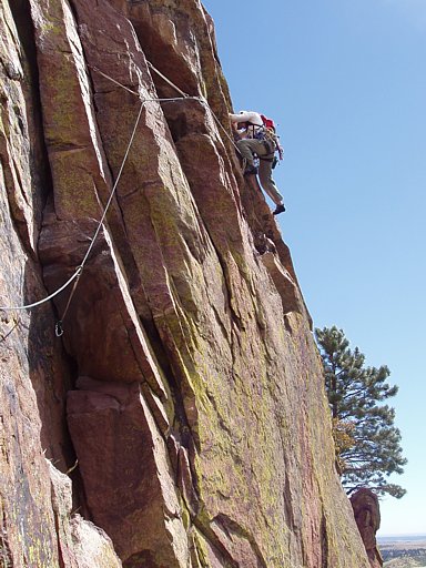 Leading through the 3rd pitch crux traverse on Ruper, Red Garden Wall, Eldorado Canyon, Boulder, Colorado