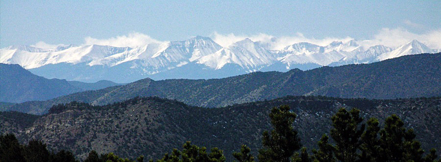 View of snow-capped Sangre de Cristo mountains from Bank area parking, Shelf Road