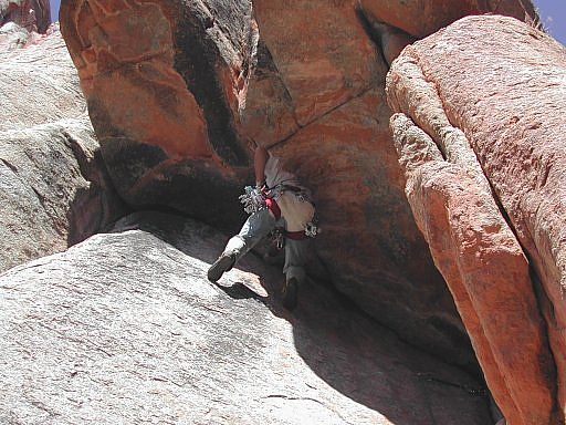 John Langston traversing the roof on Renaissance, Fortress Wall, Unaweep Canyon